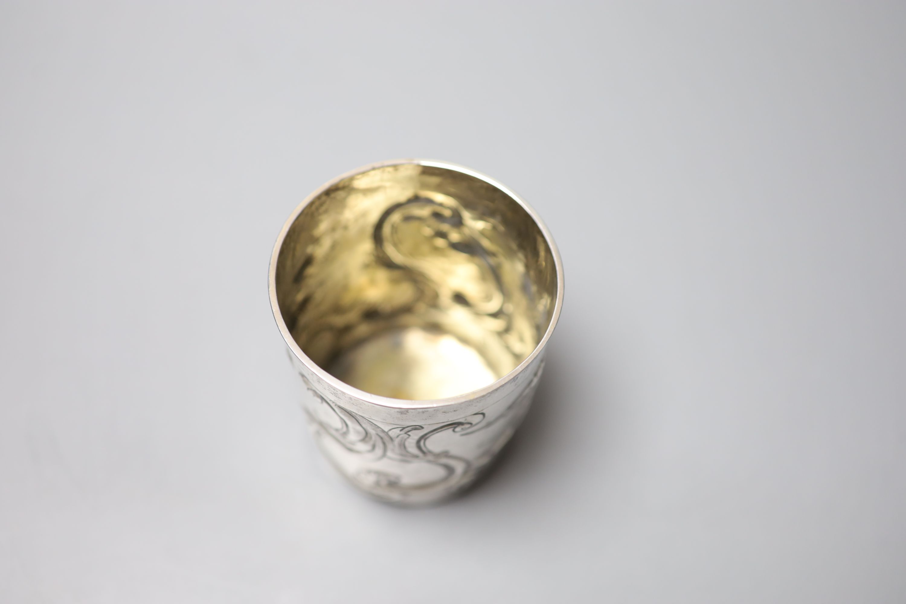 A late 18th century Russian embossed white metal beaker, assay master Alexei Viklyayev?, Moscow, 1790, 87mm, 91 grams.